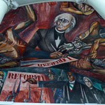 Again Miguel Hidalgo with the poster liberty and Mexico's other national hero Benito Juarez who paints the poster reforms on the bottom